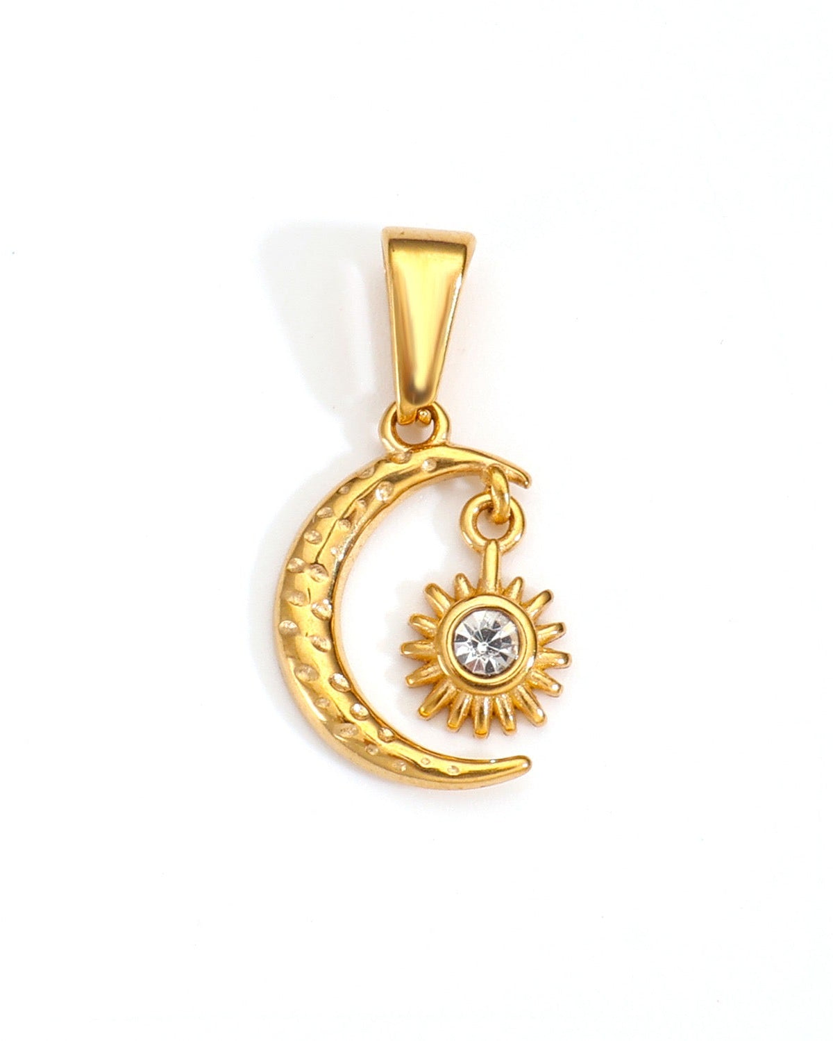 Gold pendant with moon and sun design on a white background