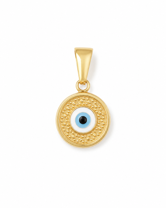 A gold circular pendant featuring an evil eye design with a light blue and white iris and a black pupil, set against a plain white background.