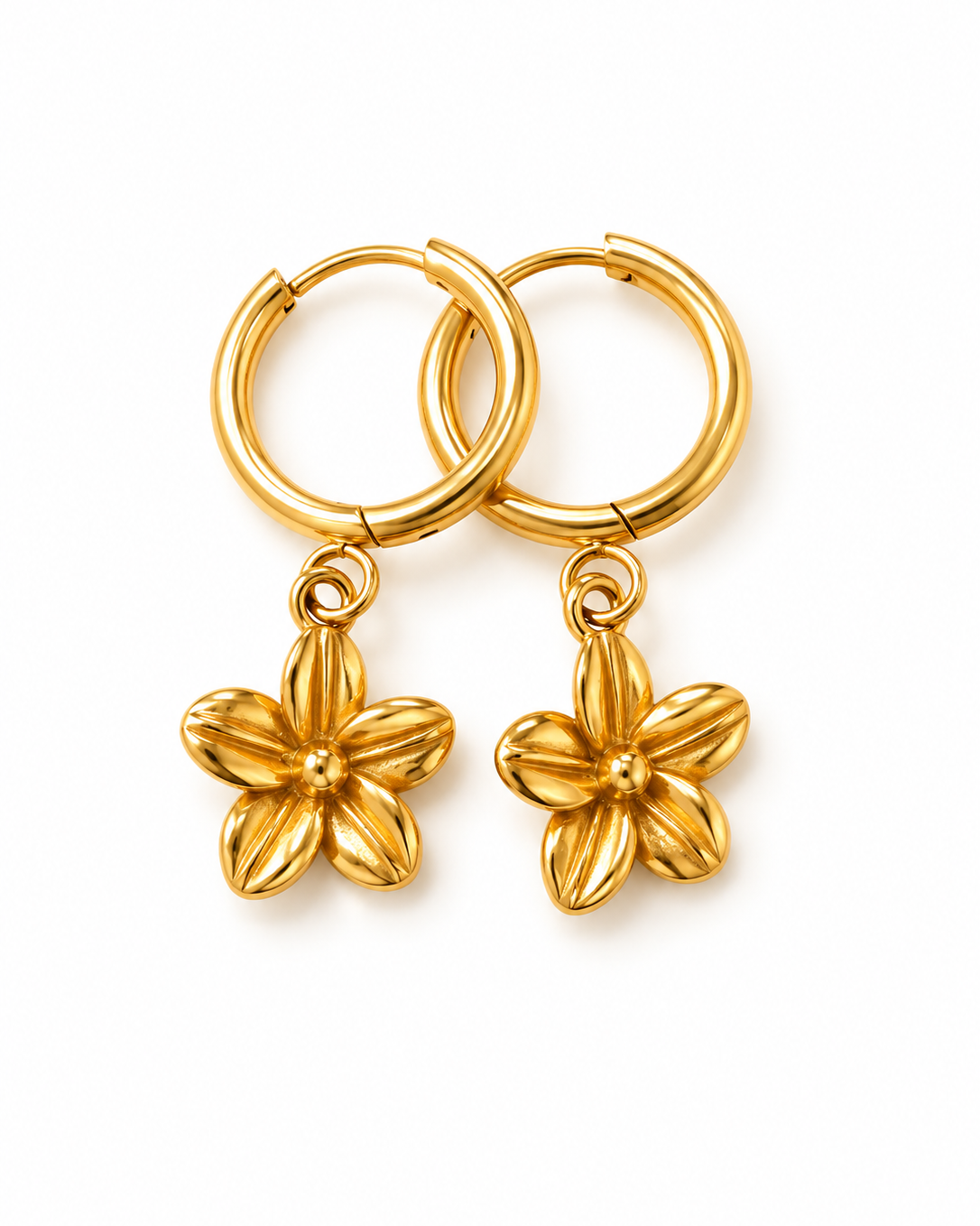 A pair of gold hoop earrings with dangling five-petal flower charms, shown on a clean white background.