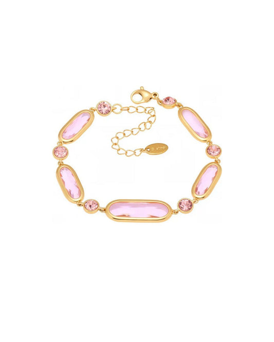 Bracelet with pink beads and gold chain on a white background