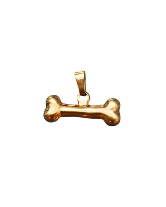 Gold bone-shaped pendant on a white background